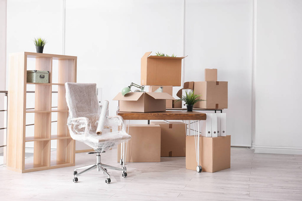 Carton boxes with stuff in room. Office move concept - Фото, зображення
