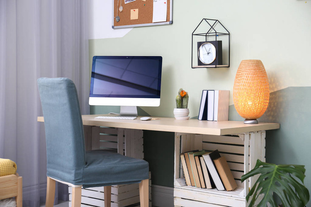Comfortable workplace with computer on desk in home office - Φωτογραφία, εικόνα