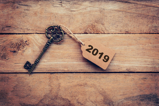 Business concept old key vintage with tag for New Year Resolutio - Photo, Image