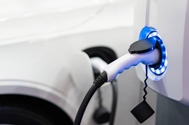 Charging an electric car battery access to vehicle electrificati - Foto, Imagen