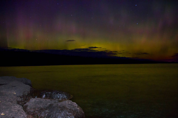 Northern Lights dance above the North Shore of Lake Superior in Minnesota - 写真・画像