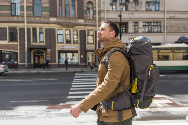 Young hipster man traveling backpacker outdoor. Travel concept. - Foto, Imagem