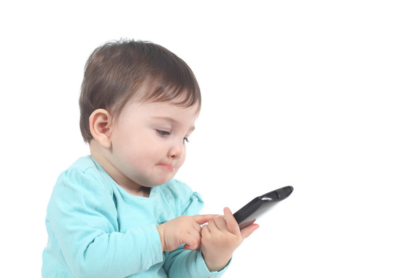 Casual baby touching a mobile phone - Foto, Bild