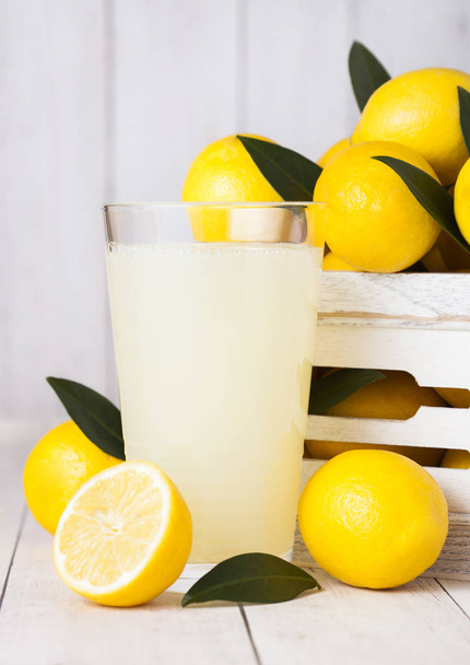 Glass of organic fresh lemon juice with fruits - Photo, Image