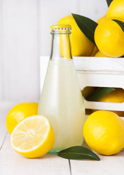 Glass bottle of organic fresh lemon juice fruits - Foto, Bild