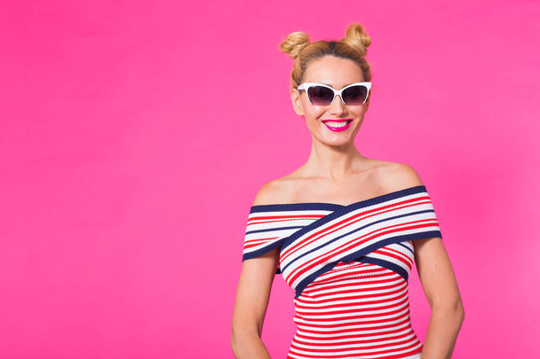 Fashion studio portrait of glamour girl, cute emotions, stylish hipster clothes sunglasses on pink background with copyspace - Valokuva, kuva