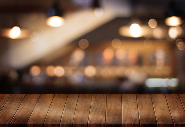 Wooden board empty table  cafe, coffee shop, bar blurred backgro - Fotó, kép