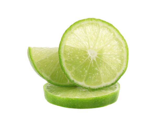 Ripe slice of green lime citrus fruit isolated on white background. Lime wedge with clipping path - Photo, Image