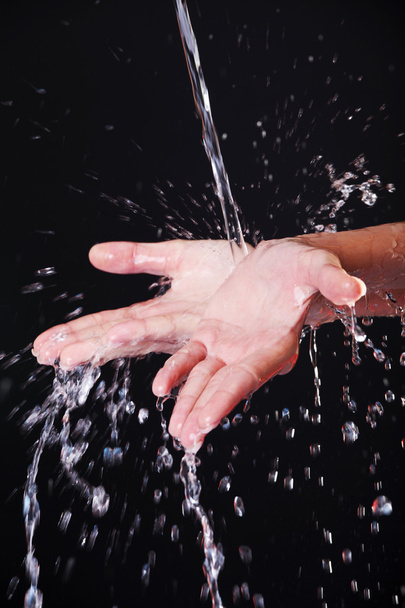 Water falling on female hands - Valokuva, kuva