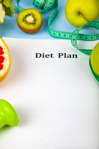 Food and sheet of paper with a diet plan - Φωτογραφία, εικόνα