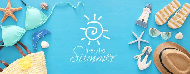 vacation and summer banner with sea life style objects and bikini over wooden background. - Foto, imagen