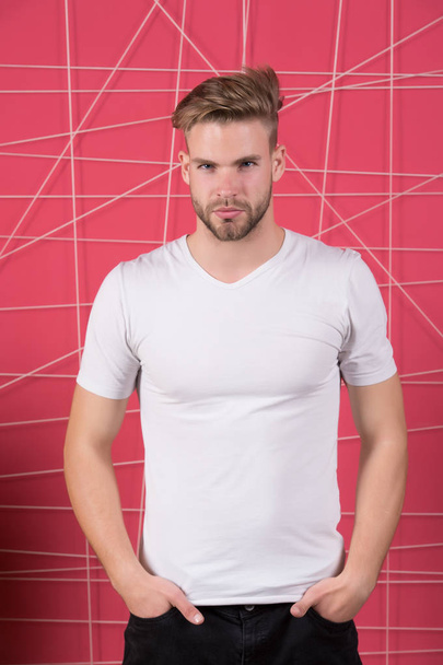Man or guy in blank white tshirt stand on pink background - Φωτογραφία, εικόνα