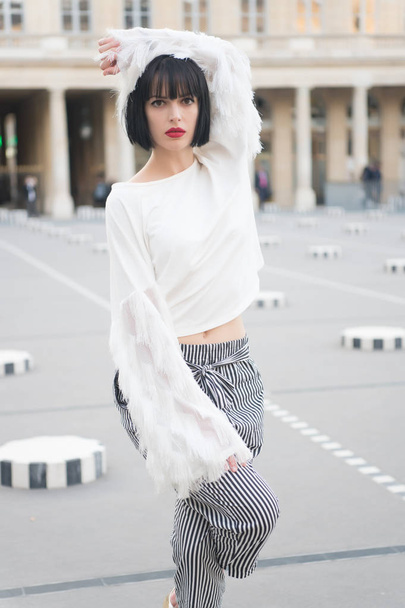 Outdoor fashion portrait of glamour sensual young stylish lady wearing trendy outfit, red lips - 写真・画像