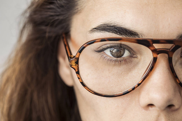 Close up of female eye with glasses - Photo, Image