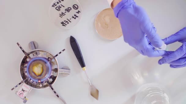 The scientist dripping water into the soil sample - Filmmaterial, Video