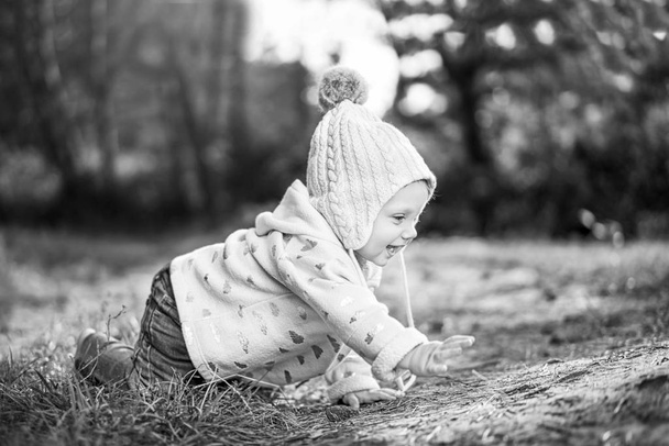 Cute little baby girl playing outdoor - Fotó, kép