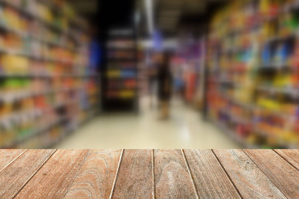 Empty Wooden Board with Blurred Supermarket Background. Suitable for Products Display. - Photo, Image