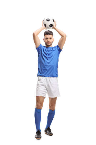 Full length portrait of a soccer player taking a throw-in isolated on white background - Photo, Image