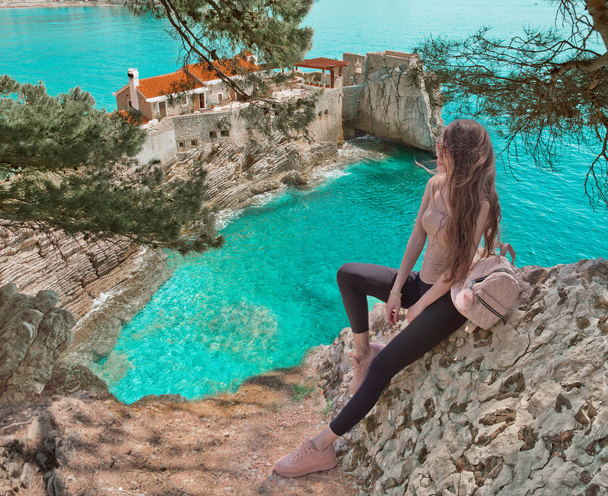 Tourist girl visiting Montenegro. Traveller sightseeing Old Vene - Photo, image