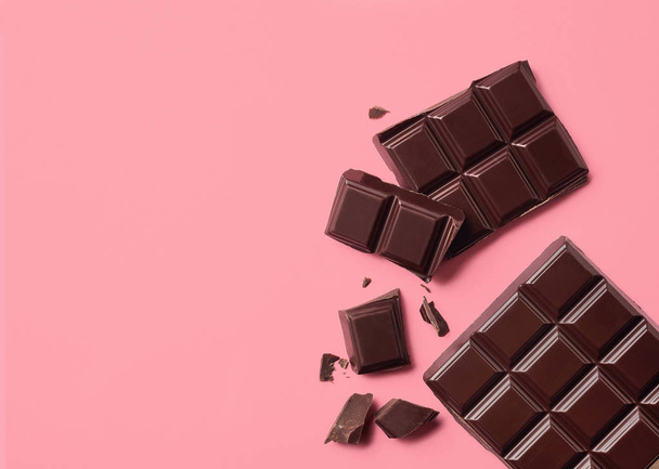 Dark chocolate on pink background - Photo, image