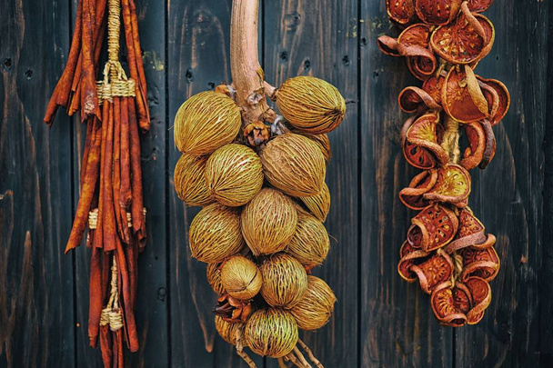 Young Dried Coconut hanging on Wooden Wall. - Photo, Image
