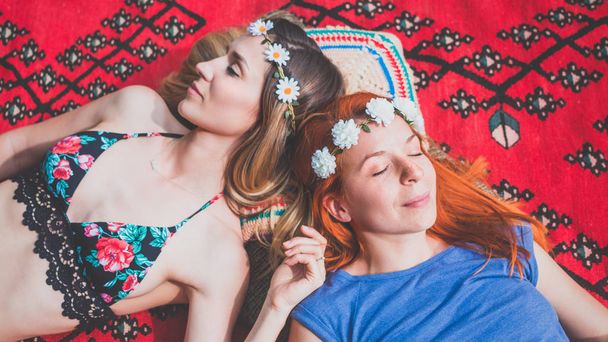 Two hippie girlfriends enjoying in the countryside - Photo, Image