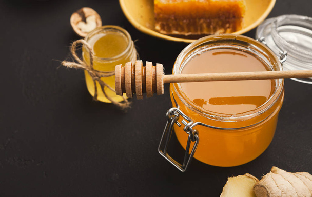 Various types of honey on wooden platter, closeup - Photo, Image