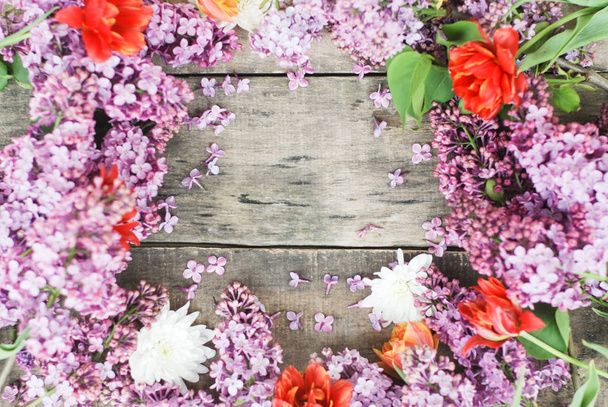 Purple Spring Lilac Frame over rustic Textured Wooden Board isolated Copy space - Фото, изображение