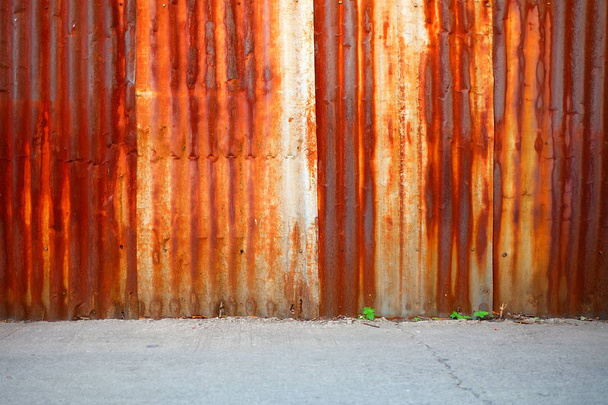 Old Rusty Zinc Wall Background with Concrete Pavement. - Fotó, kép