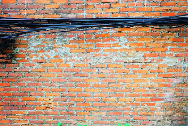 Messy Electrical Wires with Broken Old Brick Wall. - Photo, Image