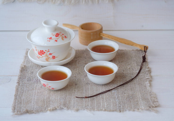 Chinese red tea Dian Hong in the shape of a brick - Фото, изображение