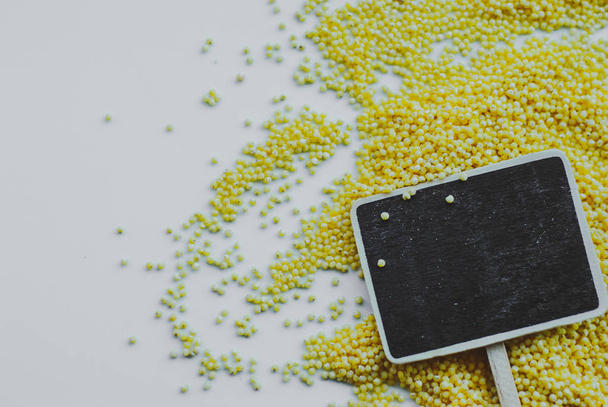 organic millet seeds and chalkboard - Photo, Image