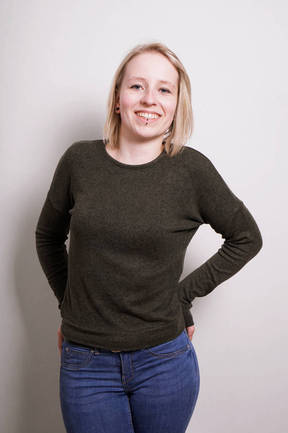 young blond millennial woman smiling - Fotó, kép