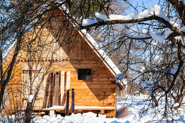 view of little wooden cottage and wide skis - Photo, Image
