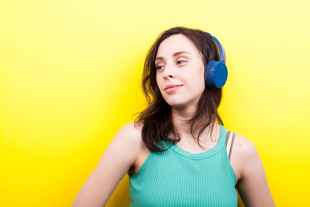 Modern young woman listening to music - Photo, Image