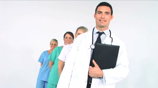 Medical team in a row isolated on white - Záběry, video