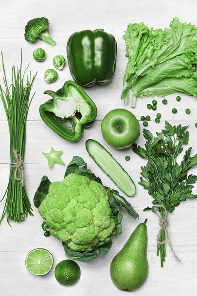 Food Background. Green Vegetables And Fruits On Wooden Table - Foto, Imagem