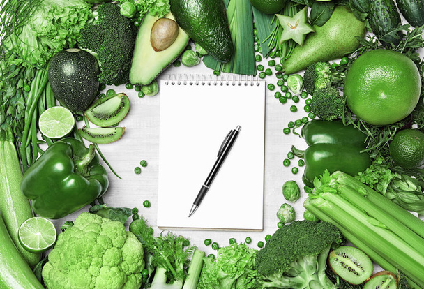 Diet Plan. Closeup Of Green Vegetables And Notebook - Fotó, kép