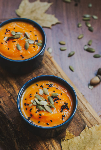 Homemade vegetable soup with pumpkin with cream and black sesame, top view with copy space - Photo, Image