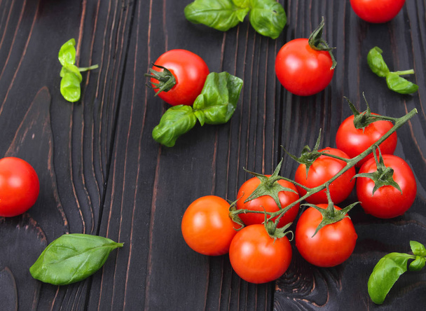 Fresh cherry tomatoes on wooden background - Photo, image
