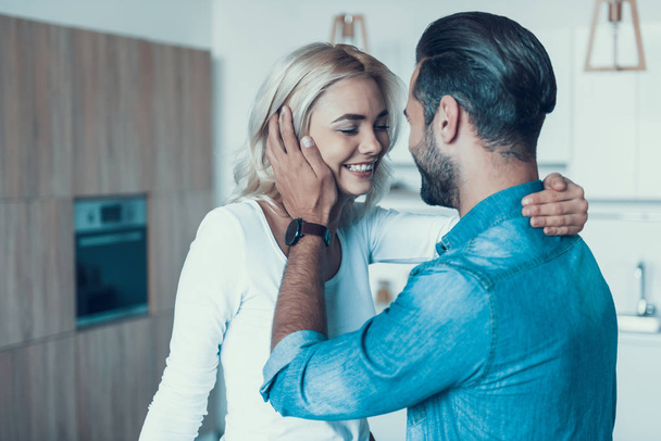 Loving happy couple together in kitchen. - Photo, Image