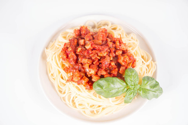 Spaghetti bolognese on a white background - Foto, afbeelding