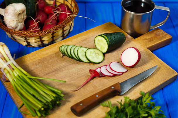 Fresh crunchy sliced cucumber and radish with spring onions and  - Zdjęcie, obraz