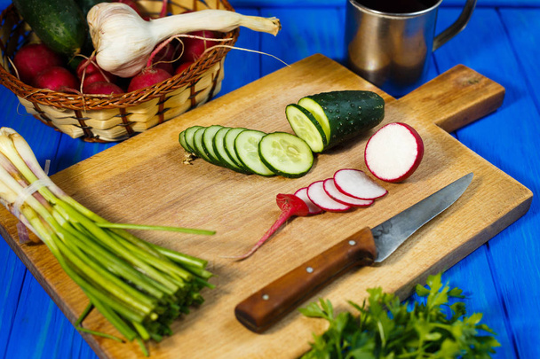 Fresh crunchy sliced cucumber and radish with spring onions and  - Foto, Imagem
