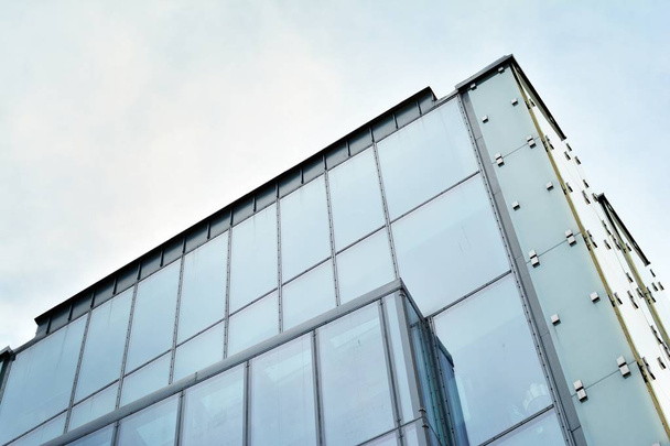 Urban abstract background, detail of modern glass facade, office business building. - Photo, Image