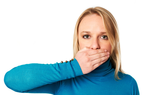 Woman covers her mouth with hand: Freedom of speech concept - Fotoğraf, Görsel