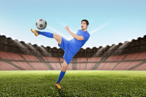 Strong soccer player kicking ball - Foto, Imagem