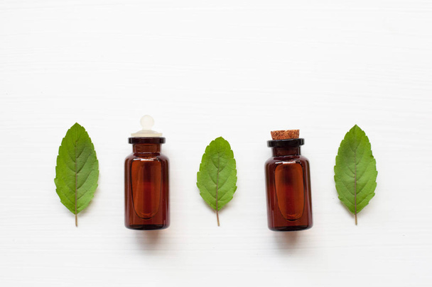 Mint essential oil with leaves. - Photo, Image