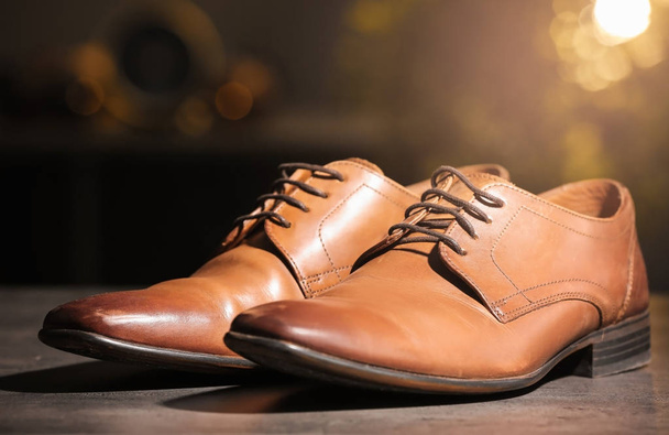Pair of elegant male shoes on blurred background - Foto, Imagen