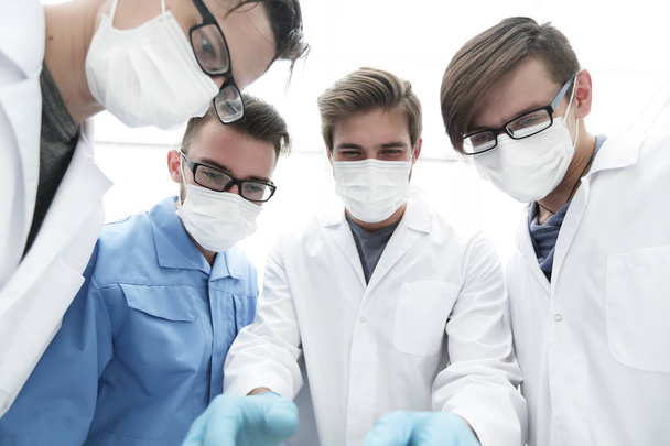 closeup. a team of doctors in protective masks. - 写真・画像